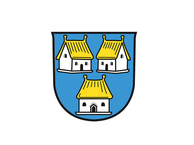 Das Wappen zeigt auf blauem Hintergrund drei weiße Häuser mit goldenen Dächern, von denen zwei oben nebeneinander und eines unten zentral platziert sind.