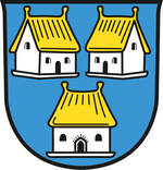 Das Wappen zeigt auf blauem Hintergrund drei weiße Häuser mit goldenen Dächern, von denen zwei oben nebeneinander und eines unten zentral platziert sind.