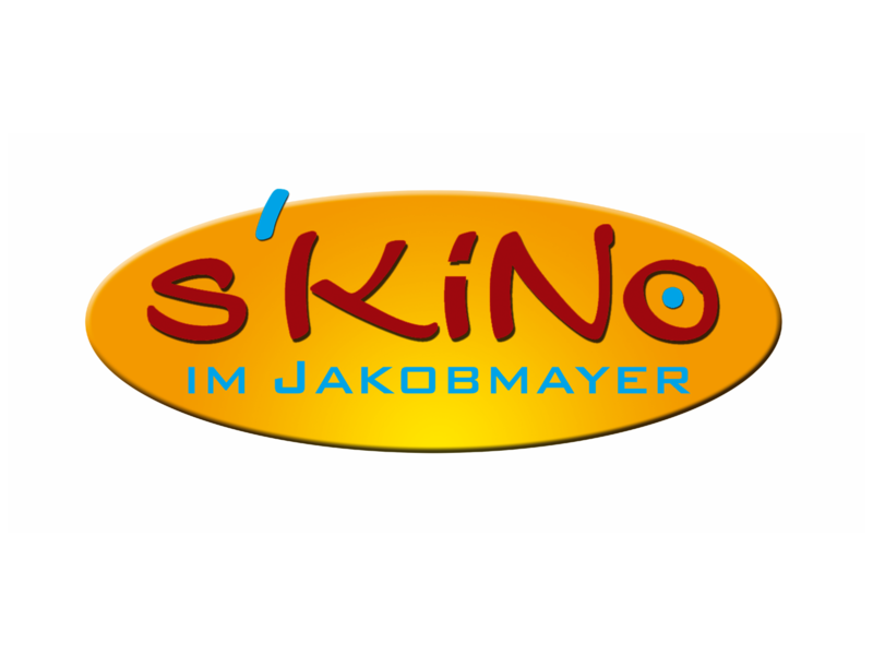 Das Bild zeigt ein ovales, orangefarbenes Logo mit der Aufschrift "s'KiNo im Jakobmayer" in roten und blauen Buchstaben.